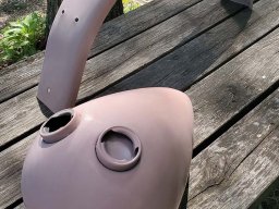 Axed gas tank and fender in primer.